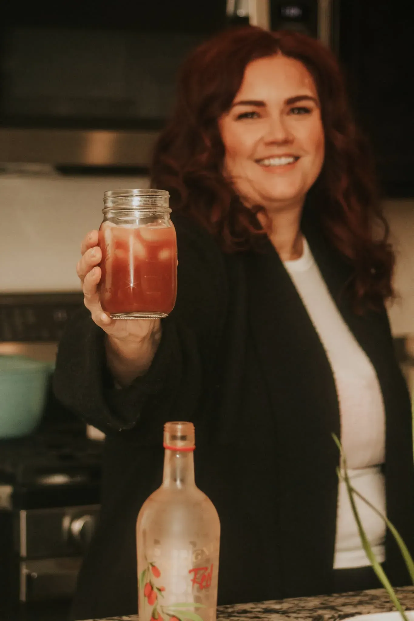 Melissa Anne holding a mason jar of NingXia Red