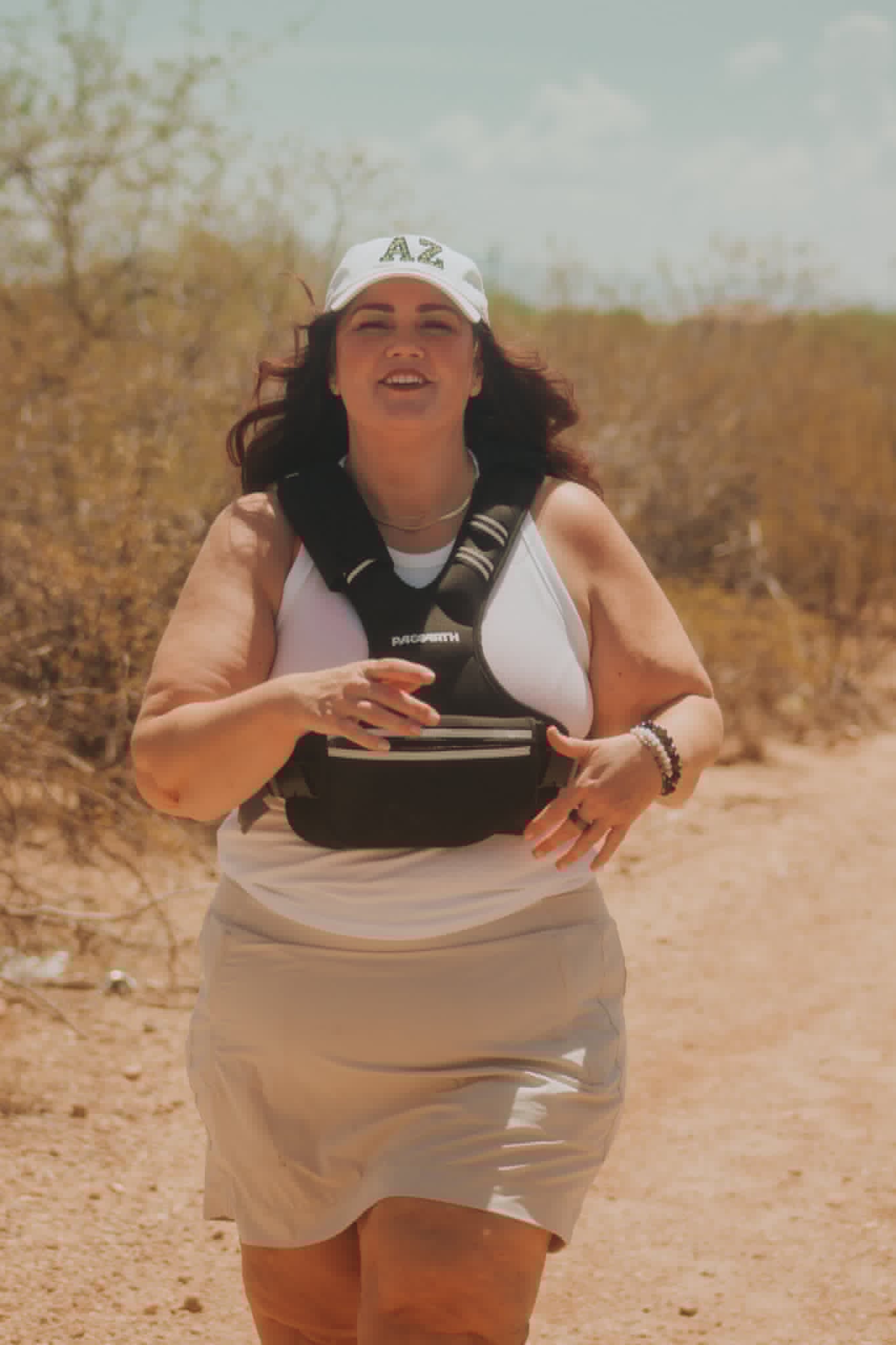 Melissa Anne walking outdoors in the desert