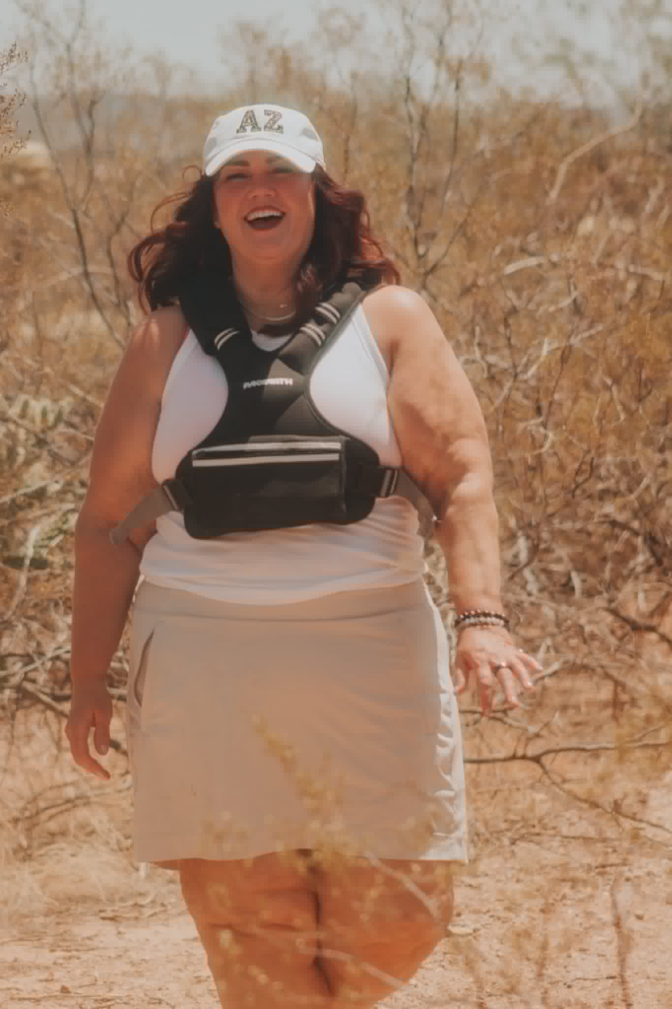 Melissa Anne laughing on a desert hike