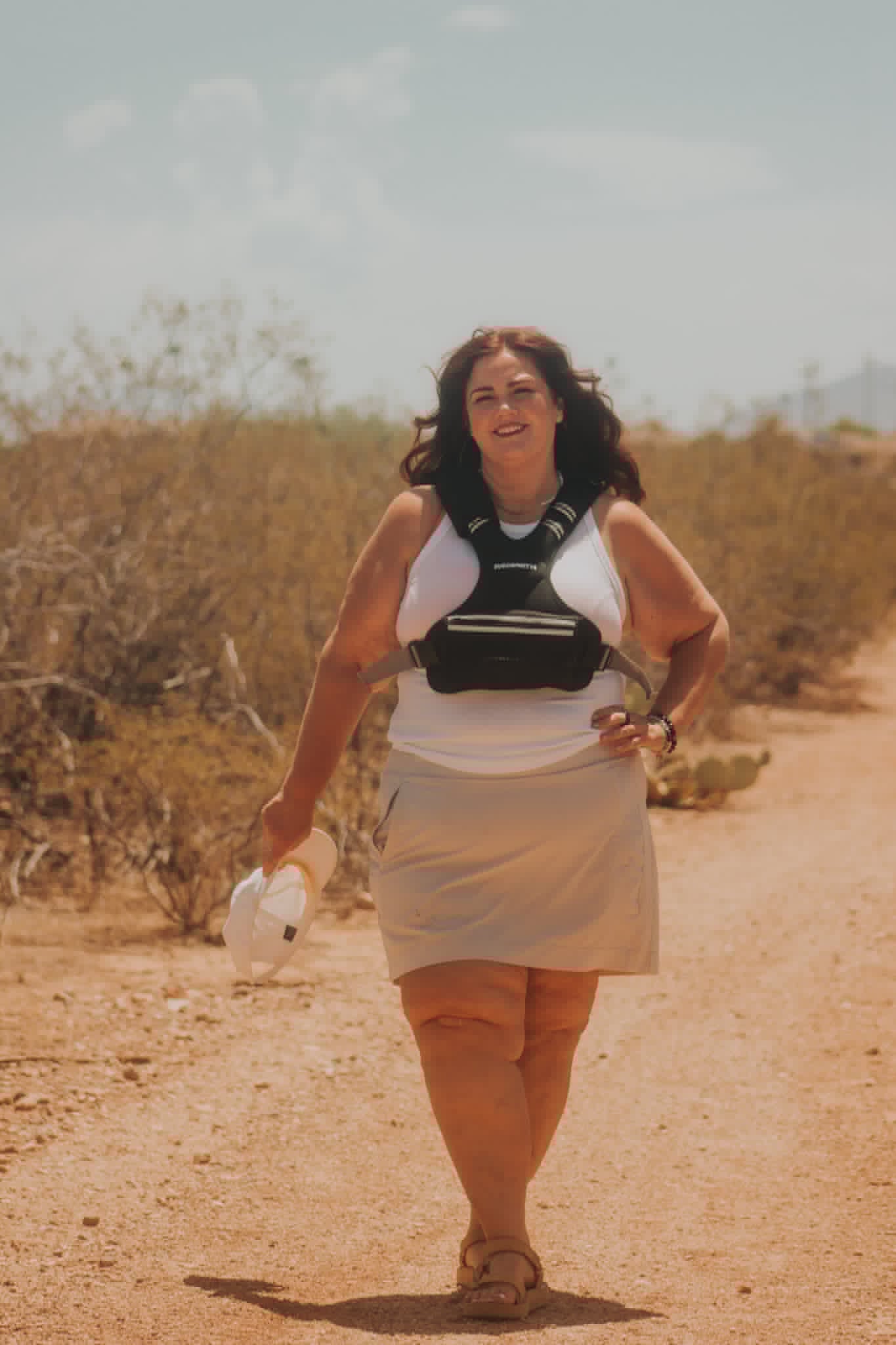Melissa Anne walking on a desert trail