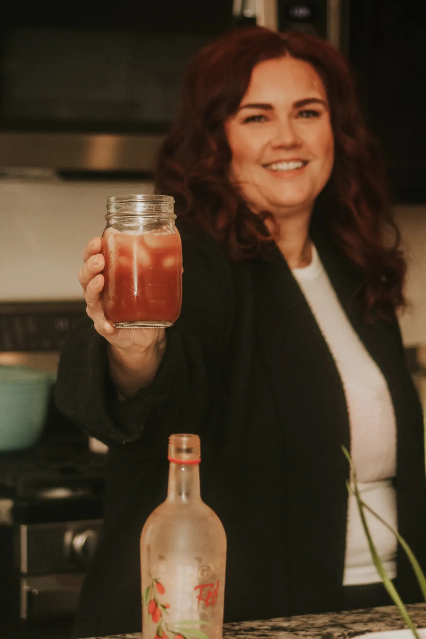 Melissa Anne laughing while pouring NingXia Red